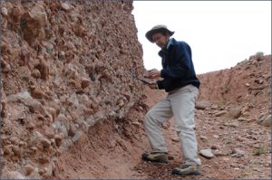 Stewart samples rocks in northwest Wyoming.