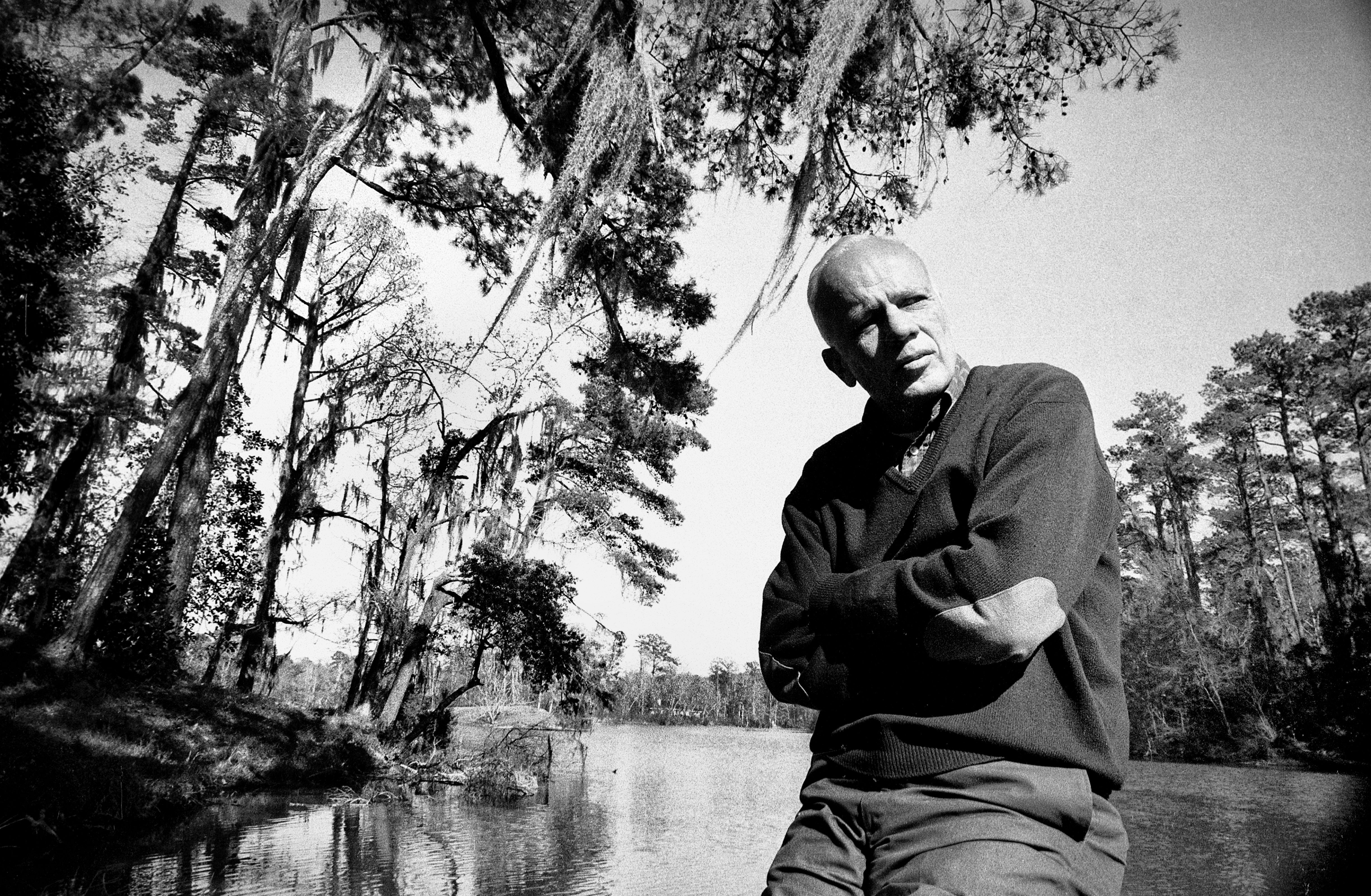 Walker Percy on the dock at Bogue Falaya at the family home in Covington, La. (photo copyright by Christopher R. Harris.)