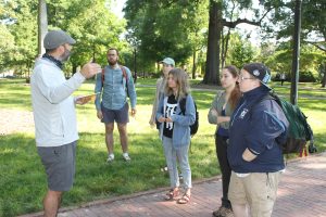 Mario Marzan (far left), associate professor of art, explains the Walkabout assignment to students in the Maymester art course, "The Walking Seminar." (photo by Beth Lawrence)