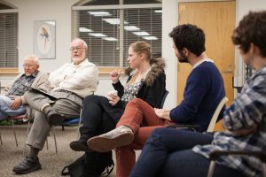 Philosophy Ph.D. students Lindsay Brainard, John Lawless and Lauren Townsend lead a discussion about "Neitzsche on Friendship" at Carol Woods Retirement Community. (photo by Rachel McClain)
