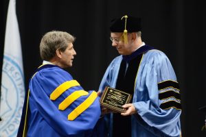 Vincas (Vin) Steponaitis (right) receiving the Faculty Award for Excellence in Doctoral Mentoring from Graduate School Dean Steve Matson.