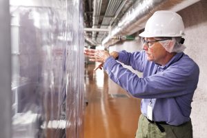 UNC physicist John Wilkerson examines the role neutrinos play in the universe at a lab in a former gold mine in South Dakota. (fall 2013 photo by Benjamin Brayfield, Rapid City Journal.)