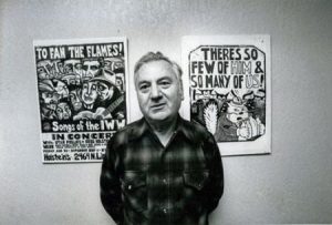Archie Green in 1987, at an exhibit of poster art of the Industrial Workers of the World. Southern Folklife Collection, University of North Carolina Library at Chapel Hill.