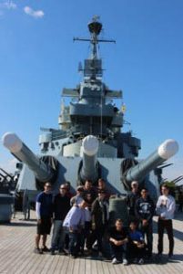 UNC students and staff at the USS North Carolina battleship.