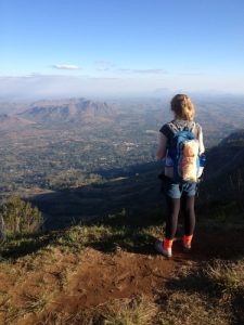 Hauser spent two summers in Malawi, Africa, researching HIV. Here, she overlooks the country’s beautiful landscape. (Photo courtesy of Blake Hauser)