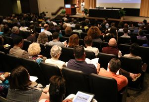 About 400 faculty and staff members gathered at the Friday Center on Aug. 17 for the THINKposium. The event examined why the world feels so polarized, to peer into the “empathy gap,” and to ponder the browning and graying of America.