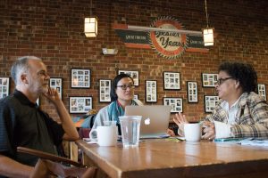 Baumgartner, Ho and Holland discuss the course at a recent meeting at the Gray Squirrel coffee shop in Carrboro. (photo by Kristen Chavez)