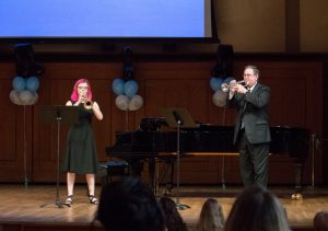 Professor Jim Ketch (right) and music major Renee McGee '20 perform "Fanfare for a New Theater" by Igor Stravinsky at the ceremony. (photo by Kristen Chavez)